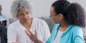 Social worker discussing issues with her client.